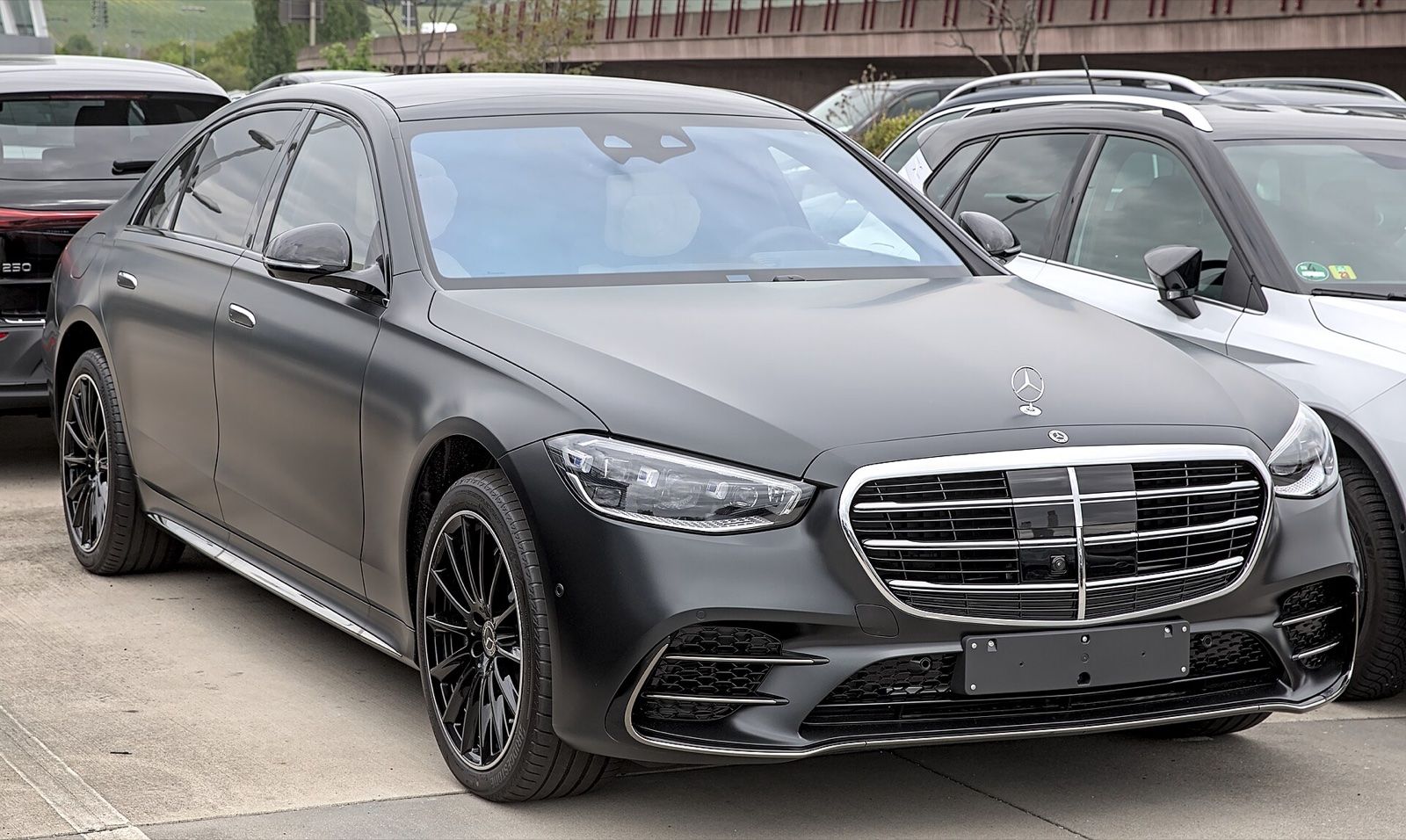 Matte black Mercedes-Benz S-Class (W223) sedan, front three-quarter view